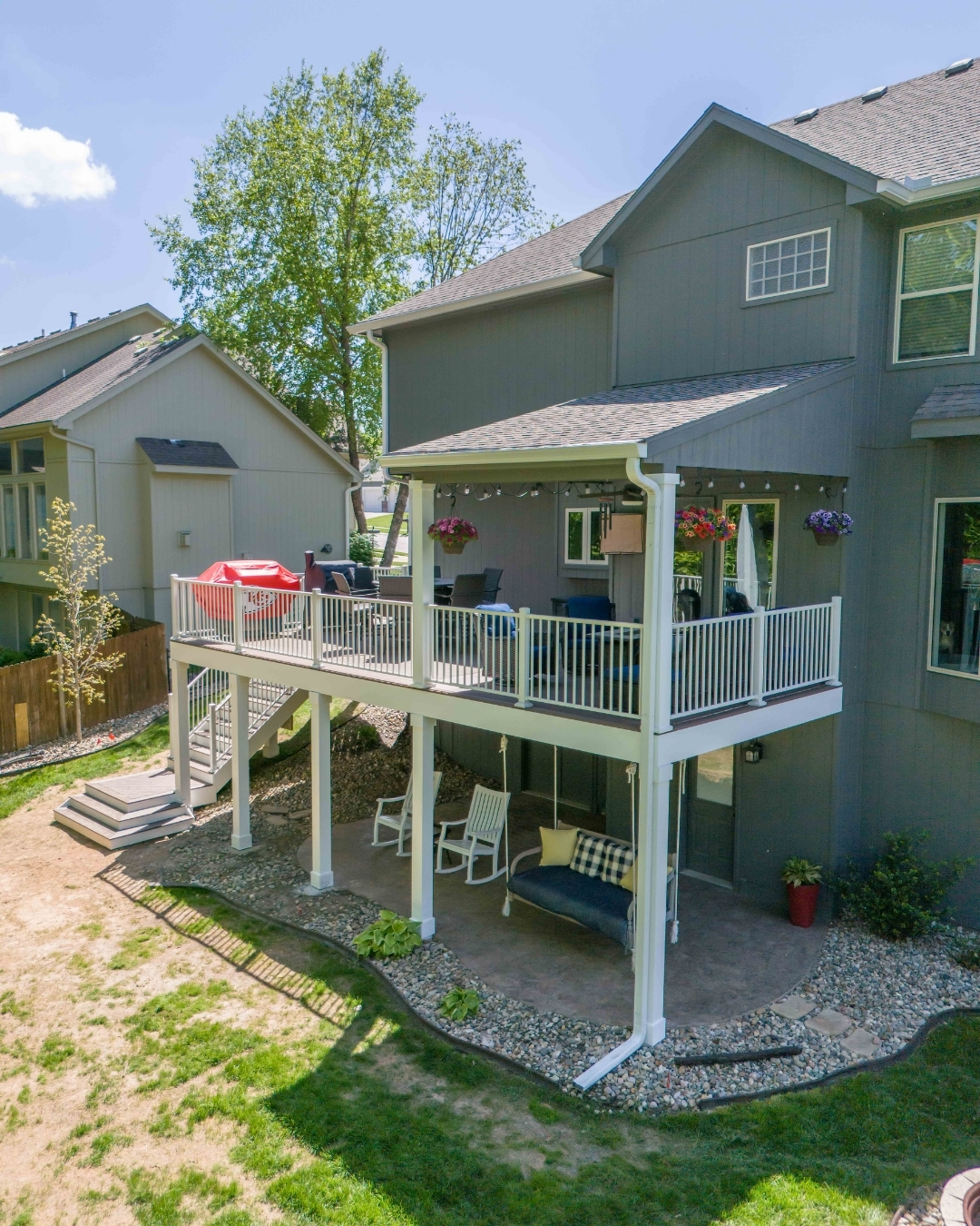 Two-story deck with covered lower patio and rock landscaping